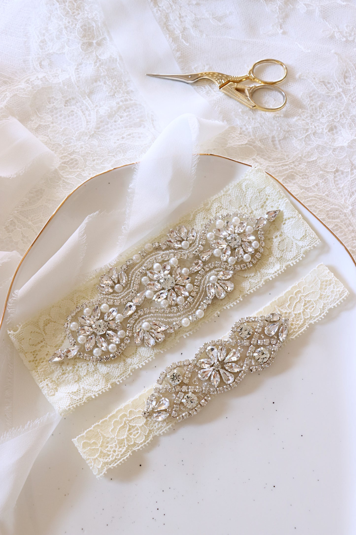 LYV | Statement luxurious wedding garter set in ivory lace with crysta shenoblesse LYV | Statement luxurious wedding garter set in ivory lace with crysta shenoblesse