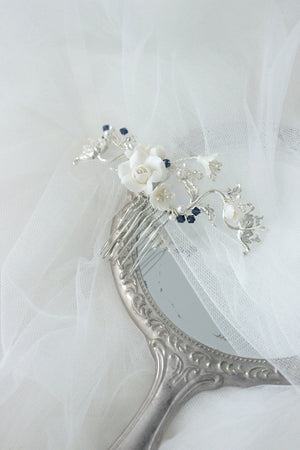 
            
                Load image into Gallery viewer, Silver bridal hair comb with roses, flowers, and blue pearls and crystals as something blue
            
        