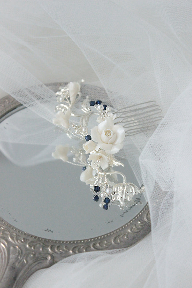 
            
                Load image into Gallery viewer, Silver bridal hair comb with roses, flowers, and blue pearls and crystals as something blue
            
        