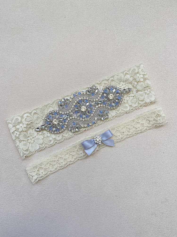 
            
                Load image into Gallery viewer, VICTORIA | Ivory Lace Wedding Garters with Light Blue Crystals - Something Blue
            
        