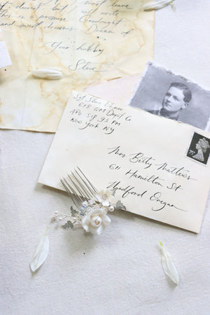 Modern bridal hair accessories for updo and wedding chignon and vintage wedding stationery with calligraphy