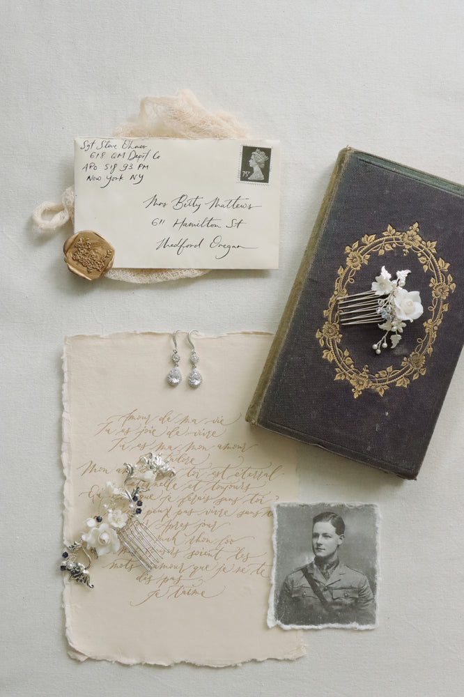 vintage wedding stationery from soldier to fiance featuring soldier photograph and crystal earrings and bridal hair combs as something blue