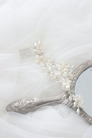 Bridal hair comb for half up half down hairstyle and veil with white flowers, pearls and silver leaves