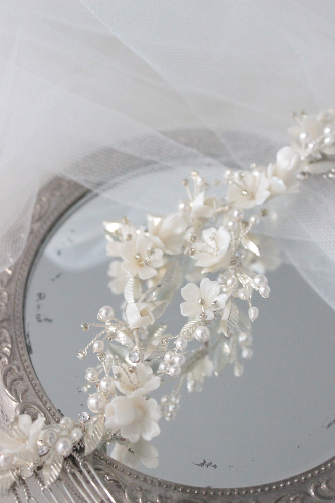 
            
                Load image into Gallery viewer, Bridal hair piece with white flowers, pearls and silver leaves
            
        