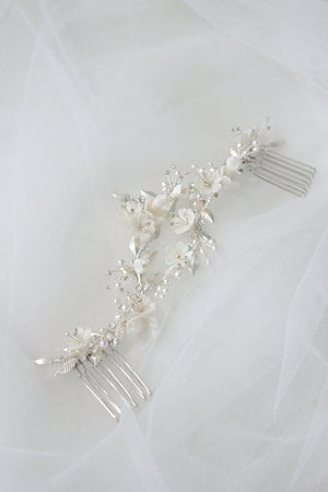 Bridal hair comb for half up half down hairstyle and veil with white flowers, pearls and silver leaves