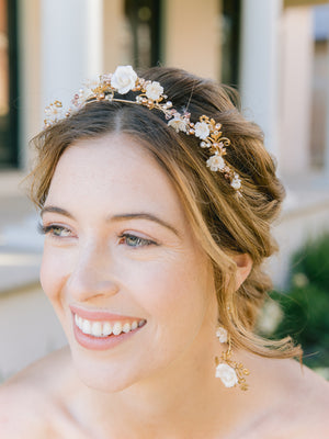 
            
                Load image into Gallery viewer, bride wearing a floral gold blush wedding crown with blush pearls with floral gold drop earrings
            
        