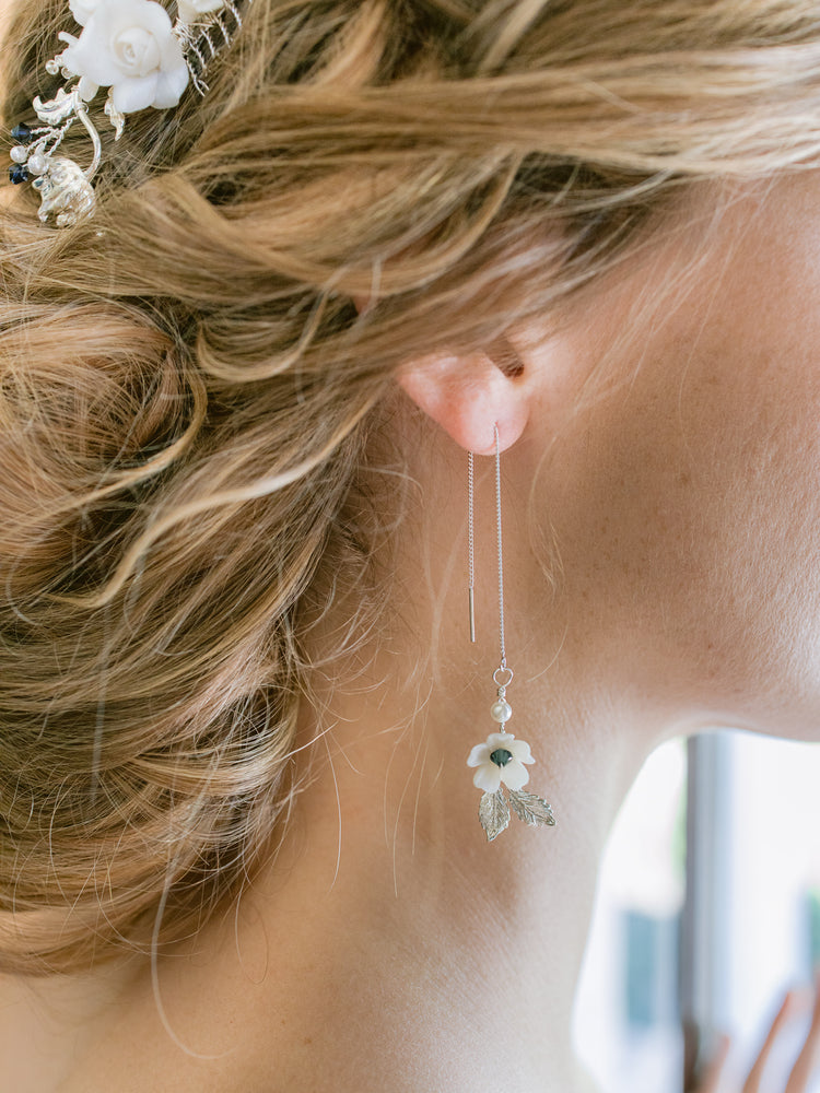 Bride wearing floral silver thread drop earrings for her wedding