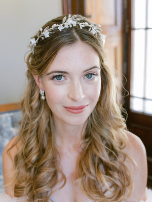
            
                Load image into Gallery viewer, happy bride getting ready, wearing silver leaf and flower tiara with pearls and crystal stud earrings 
            
        